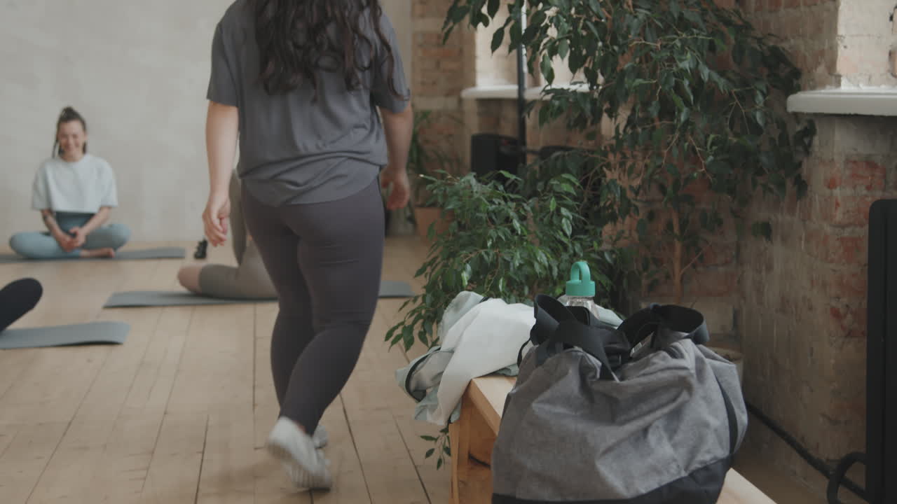 Young Woman With Down Syndrome Attending Yoga Class