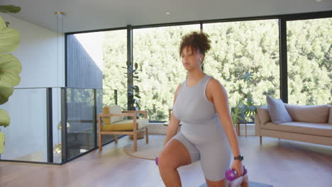 exercising at home, plus size woman lifting dumbbells on yoga mat, copy space