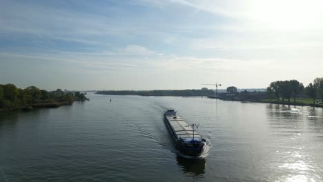 Aerial-Around-Forward-Bow-Of-Diva-Motor-Freighter-Ship-Travelling-Along-Oude-Maas