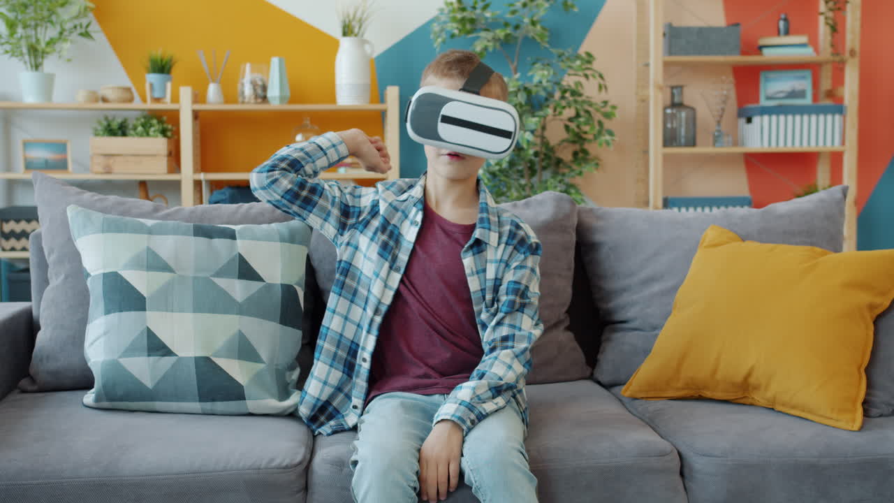 Boy Wearing VR Headset on a Couch