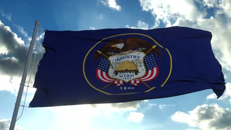 flag of utah waving in the wind against deep beautiful clouds sky