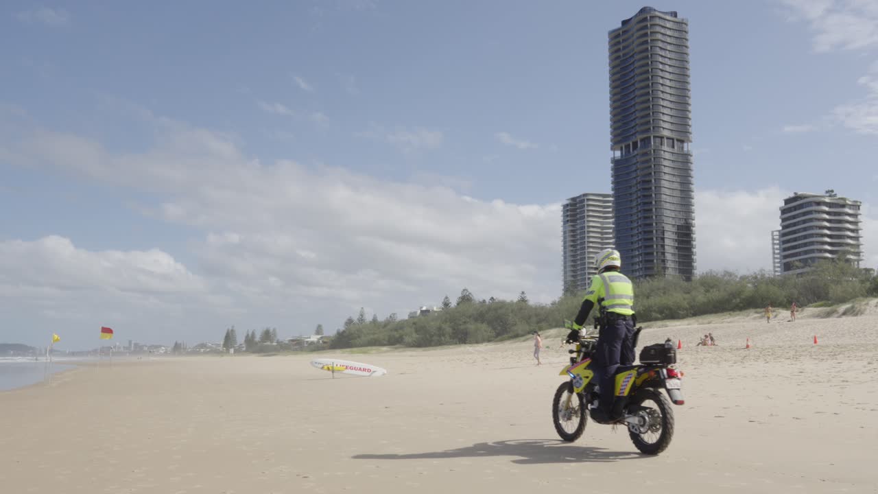 Lifeguard on motorcycle motocross at beach of Gold Coast Australia