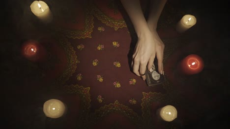 Candles Arranged in a Star Pattern on a Decorated Tablecloth