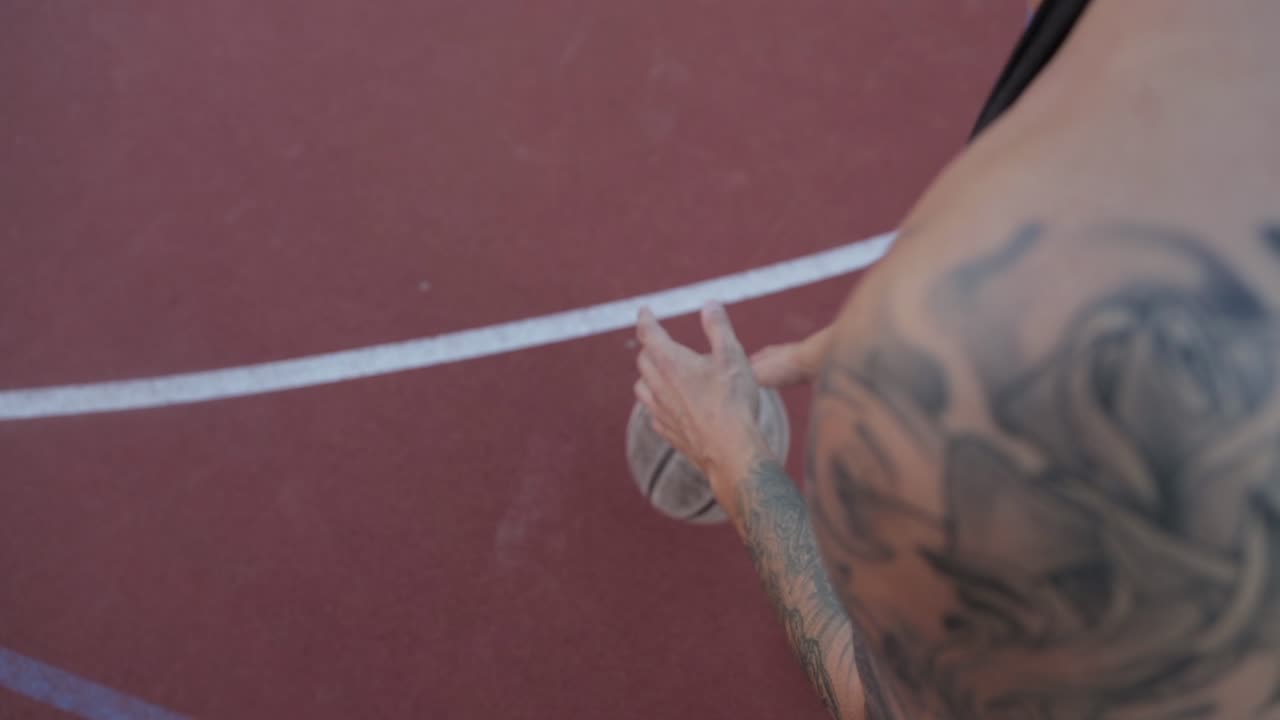One guy play basketball at district sports ground