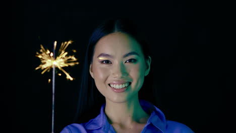 woman holding sparkler