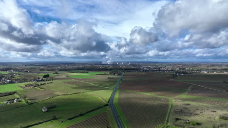 Nuclear-power-near-Beaumont-en-veron-aerial-shot-sunny-day-green-grass