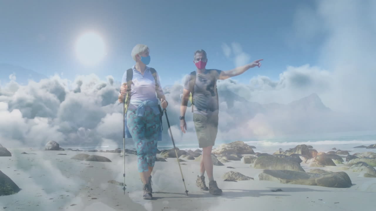 Couple walking on rocky beach, presenting travel infographic with route map and mask icons