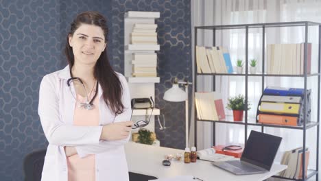 Successful-female-doctor-in-glasses-looking-at-camera.