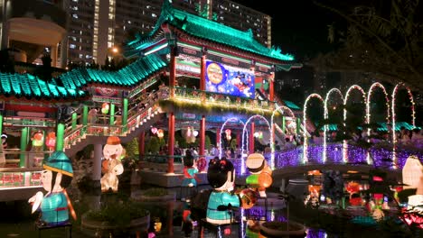 nighttime view of a public park decorated with chinese lanterns at a lantern show as visitors are seen inside the wong tai sin temple complex during the mid-autumn festival