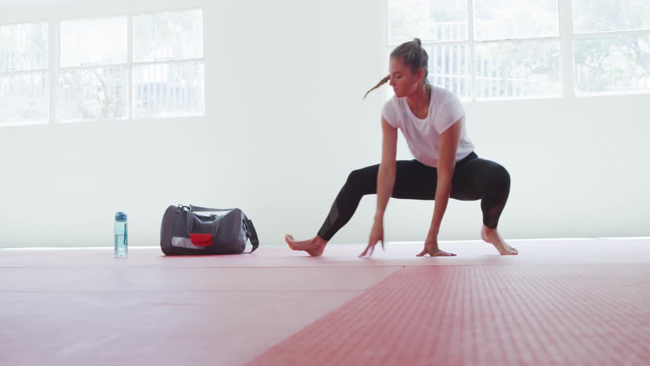 Caucasian woman stretching before training