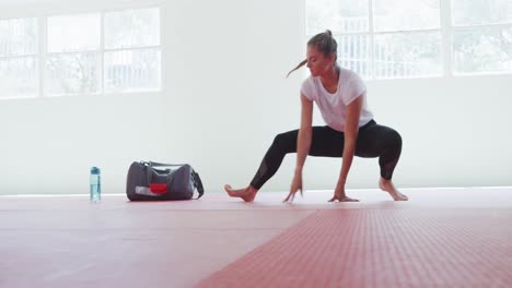 caucasian woman stretching before training