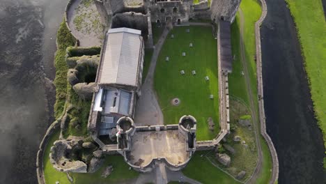 Top-view-of-Caerphilly-Castle-surrounded-by-moat,-South-Wales,-United-Kingdom