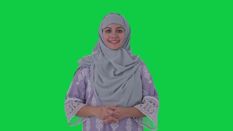 Happy-Muslim-woman-smiling-to-the-camera-Green-screen