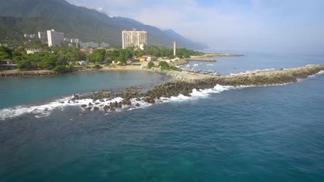 Birds-eye-view-of-the-breakwater-coastline-in-the-calm-Caribbean-Sea