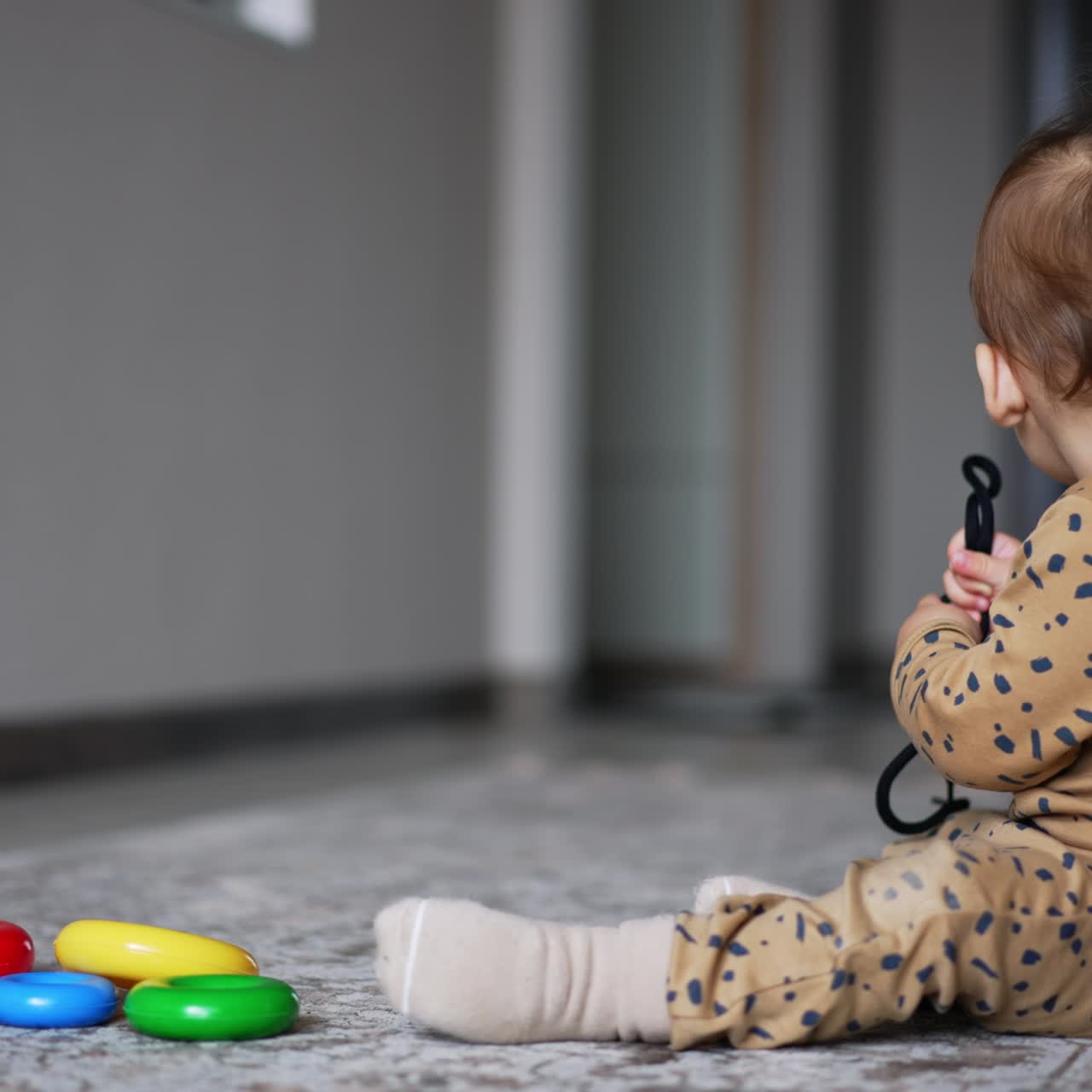 Colorful toy playing by cute child. A little boy plays with educational toys