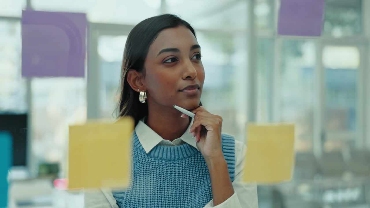 Writing, thinking and business woman with notes