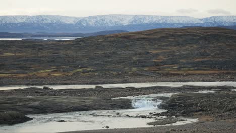 Tundra-landscape-with-snowy-mountains