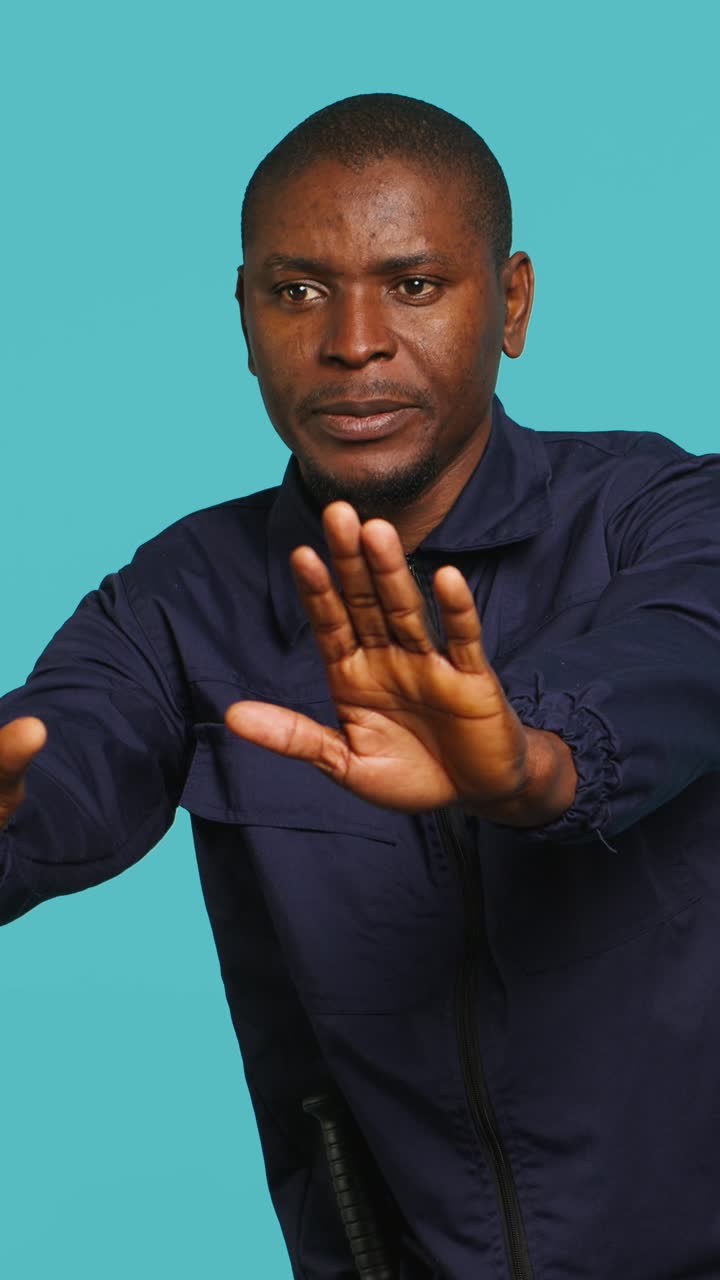 African American Man Making Stop Gesture with Hands