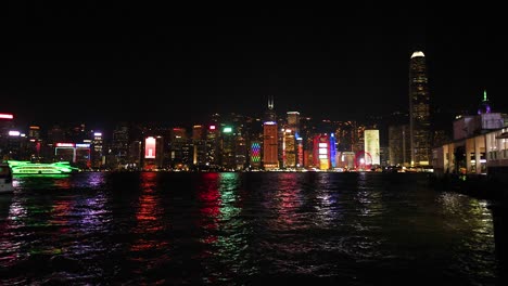 colorful reflections on water in hong kong
