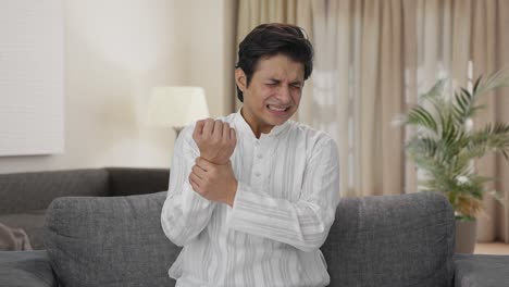 Sick-Indian-man-having-hand-pain