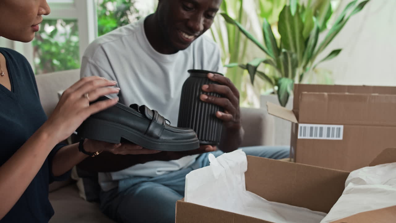 Biracial Man and Woman Discussing Purchases from Online Store