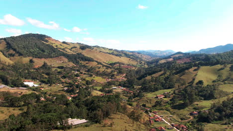 a scenic aerial view showcasing the rolling hills and lush greenery of the countryside in delfim moreira, minas gerais, brazil