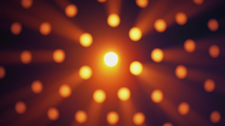 Raggi di luce attraverso fori rotondi