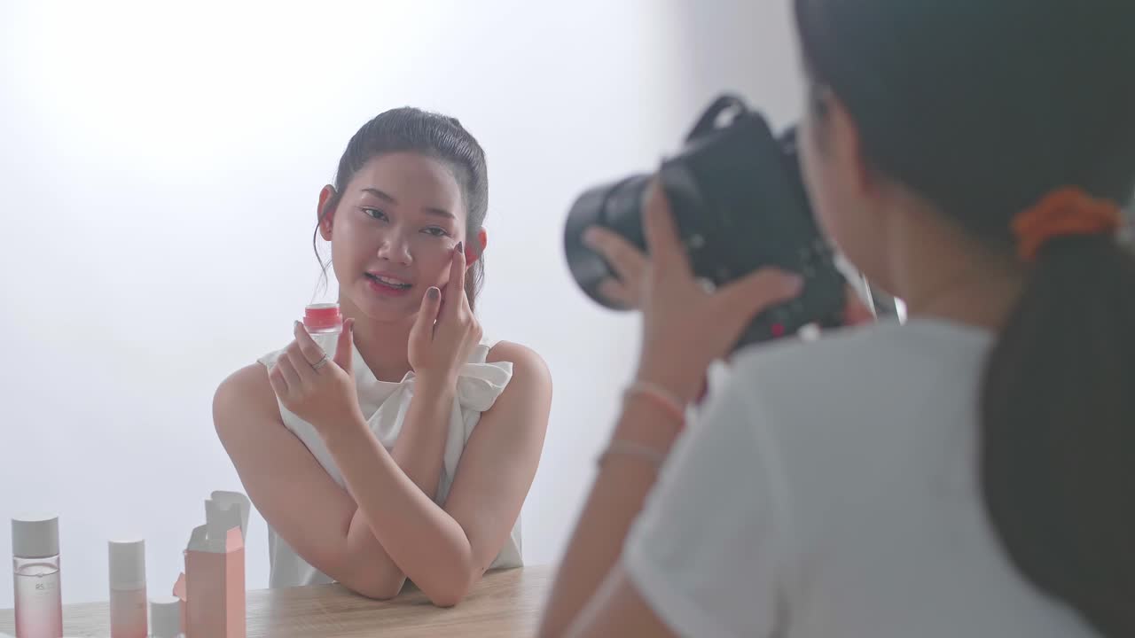 Behind The Scenes On Photo Shoot: Beautiful Asian Model Poses For A Photographer, She Takes Photos With Professional Camera