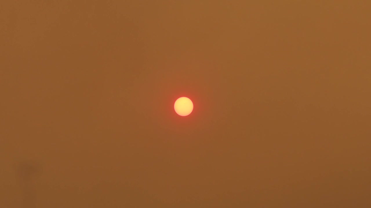 Orange Red Glowing Sun With Smokey Hazy Sky From Bush Fires, Daytime Australia, East Gippsland, Victoria, Maffra