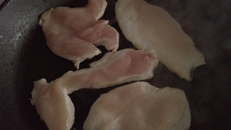 Top-Down,-Chicken-Fillets-Cook-in-Steaming-Frying-Pan,-Closeup-Detail