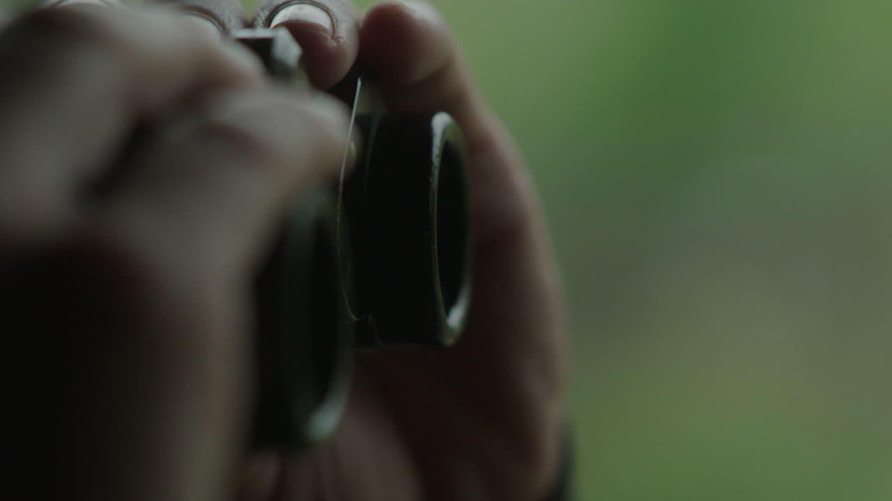 Person using camera or binoculars