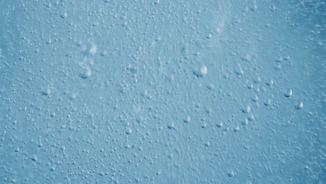 oxygen bubbles in water on a blue abstract background