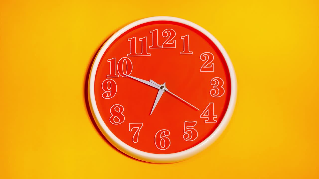 Modern orange clock face beginning of time 06.40 on yellow background, Time lapse 20 minutes moving fast.
