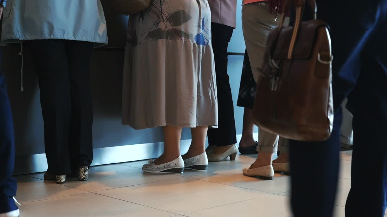 People in Line at a Counter
