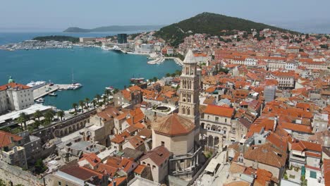 a an aerial picture of split city centre showing diocletian's palace, the bell tower of the cathedral of st domnius