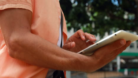 Man-using-tablet-pc