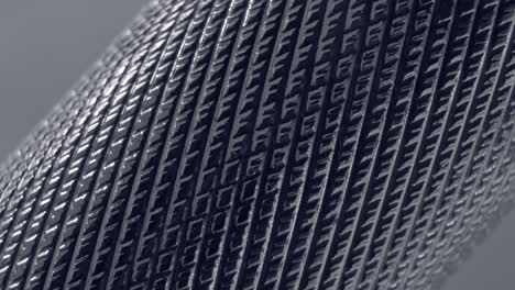 el patrón metálico de primer plano, la textura del cromo, la rotación suave.