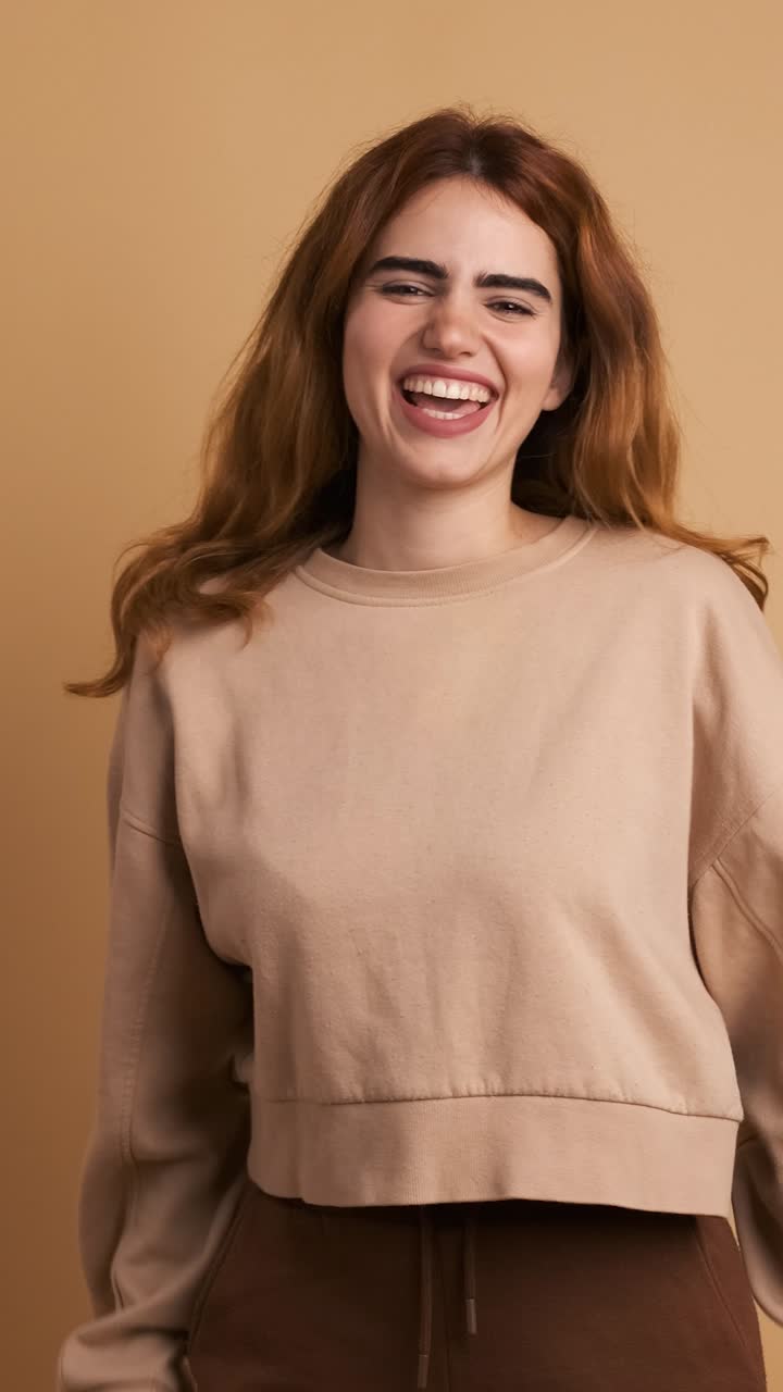 Woman celebrating gesturing with fists a surprising new. . Vertical Footage