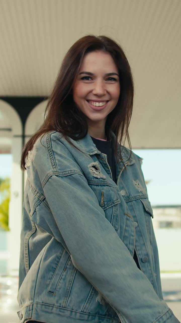 Woman fueling her car at a gas station