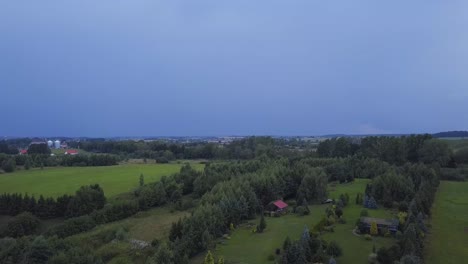 Aerial-Shot-of-a-Lightning-Strike-in-a-Distance-over-a-Countryside