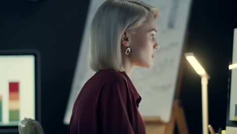 Focused-business-woman-thinking-front-computer-in-night-office.