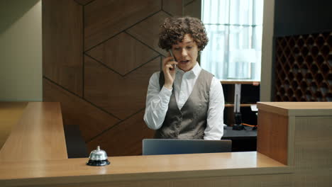hotel receptionist on phone