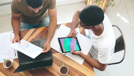 two young men chatting over coffee in a coffee