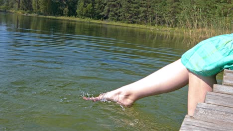 An-adolescence-lady-with-legs-that-flip-hard-the-water,-she-is-having-a-good-time-alone