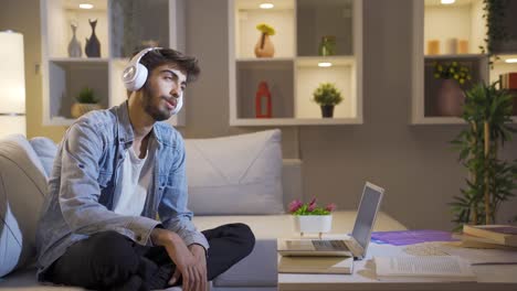 Man-dancing-at-night-while-listening-to-music-at-home.