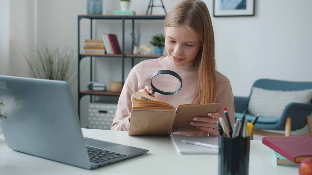 Girl Studying at Home with a Magnifying Glass