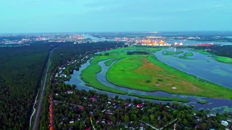 colorful nature area with in the background the industrial lights