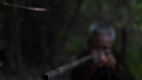 hunter target with laser sight in forest