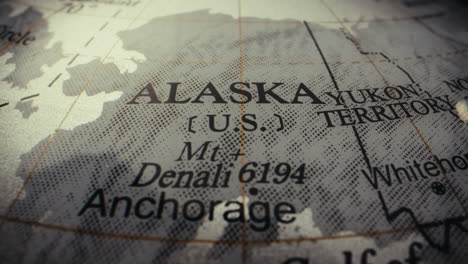 close-up of an alaska map on a world globe