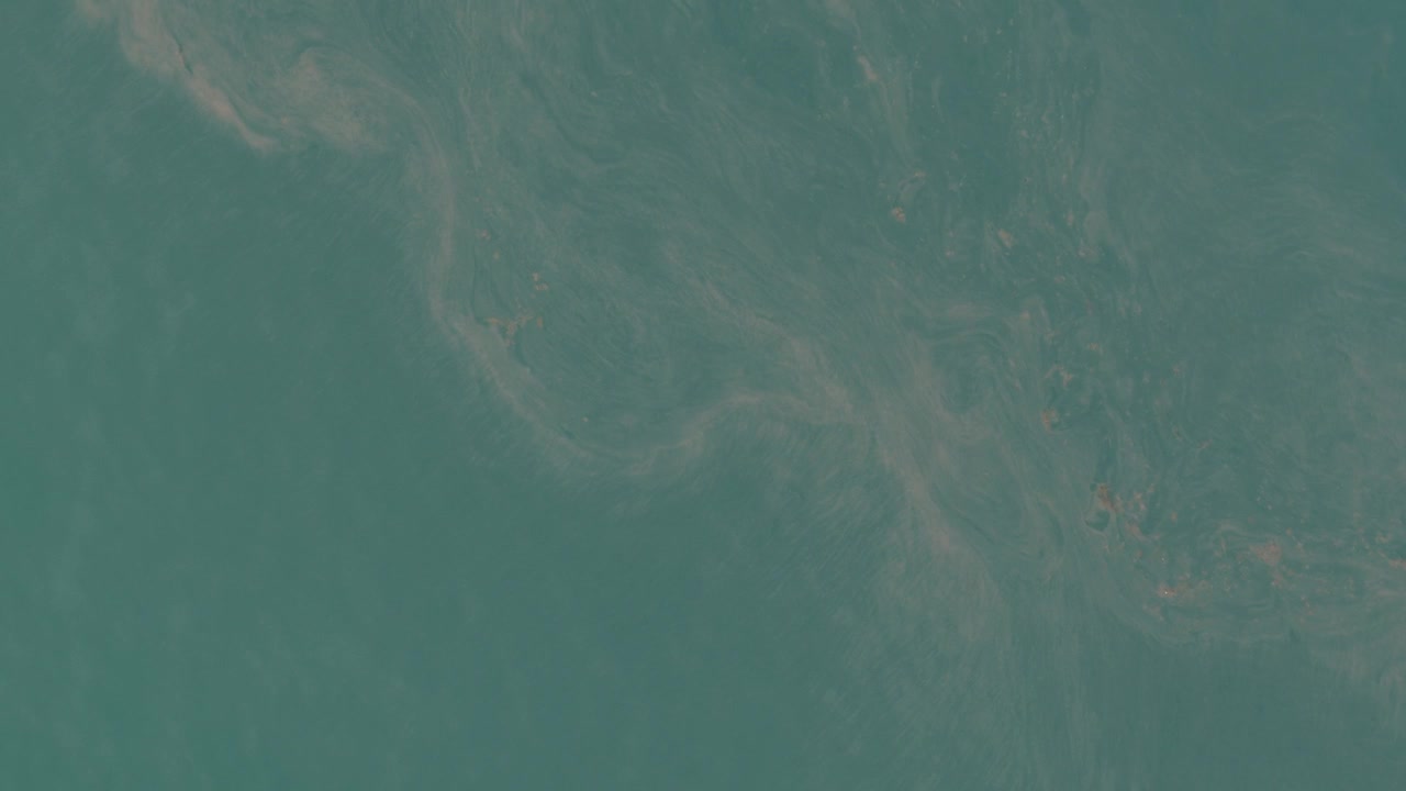 Aerial Abstract Texture of Blue Ocean Water and Sea Foam